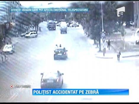 IMAGINI SOCANTE! / Politist lovit pe trecerea de pietoni