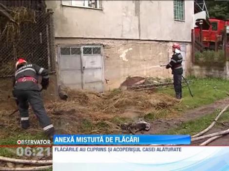 Anexa gospodareasca mistuita de flacari