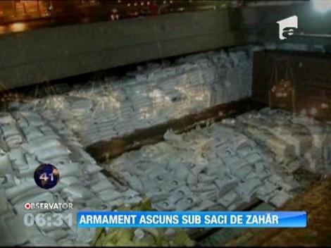 Armament ascuns in saci de zahar
