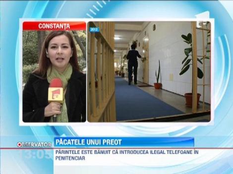 Un preot din Bacau, banuit ca introducea ilegal telefoane in penitenciar