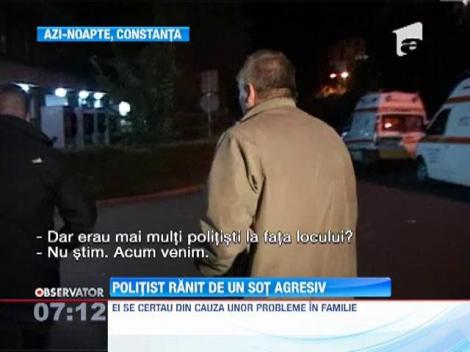 Politist ranit de un sot agresiv