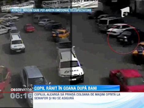 IMAGINI SOCANTE! / Copil ranit in timp ce incerca sa spele parbrize