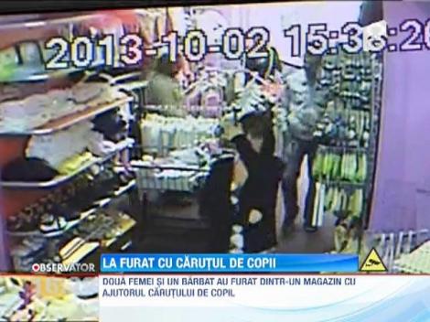 Doua femei si un barbat au furat dintr-un magazin cu ajutorul carutului de copil
