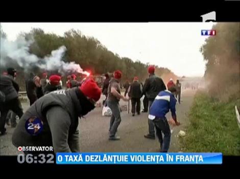 Franta: O noua taxa pentru transportatori a degenerat in ciocniri violente cu fortele de ordine