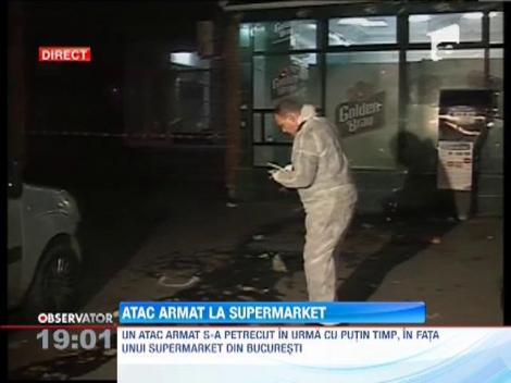 Atac armat în faţa unui supermarket din Capitală! Mai mulţi oameni au fost împuşcaţi