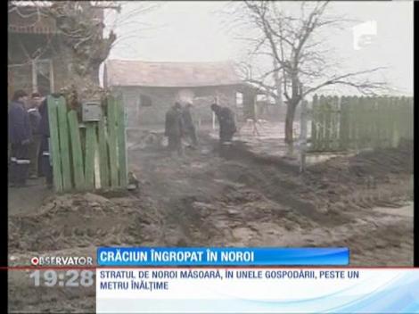Crăciun îngropat în noroi