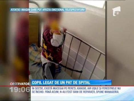 Update / Copil legat de pat cu hamuri