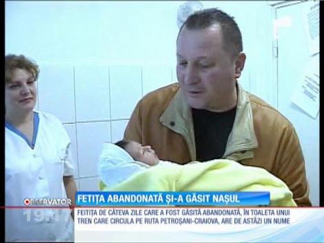 Fetița abandonată de mamă și-a găsit nașul