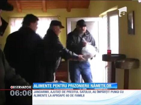 Jandarmii au împărţit alimente într-un sat rupt de lume până acum două zile din cauza nămeţilor