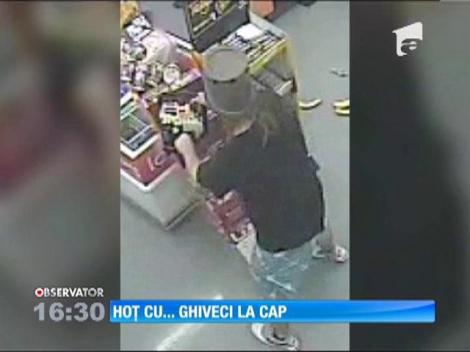 Un hoţ din SUA a încercat să jefuiască o benzinărie cu un ghiveci pe cap