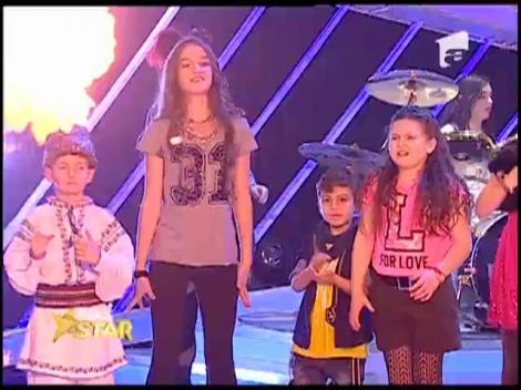 Foştii concurenţi de la Next Star interpretează melodia "Let me entertain you" a lui Robbie Williams