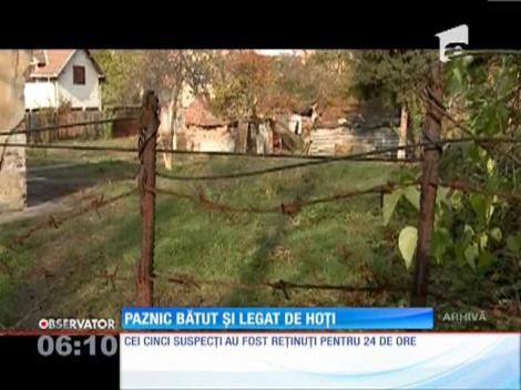 Paznic bătut și legat de hoți