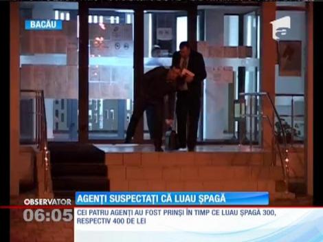 Agenți de poliție suspectați că luau șpagă