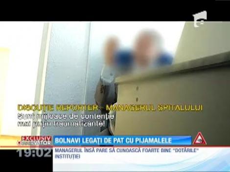 Bolnavi legaţi de paturi cu propriile pijamale