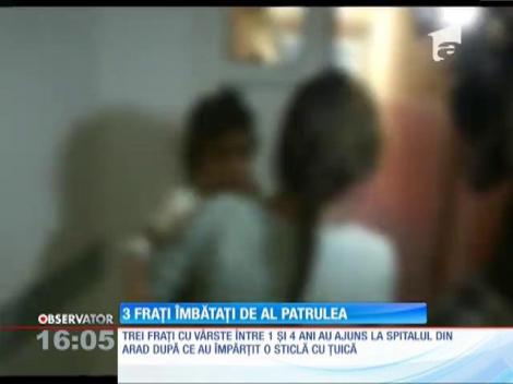 Trei fraţi de unu, doi şi patru ani, internaţi după ce au băut o sticlă de ţuică