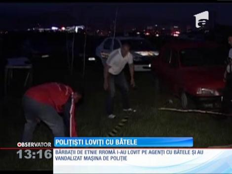 Poliţişti bătuţi cu bâtele de rromi, la Baia Mare