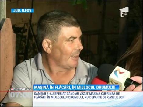 O maşină a luat foc pe o stradă din Bucureşti, sub privirea disperată a şoferului