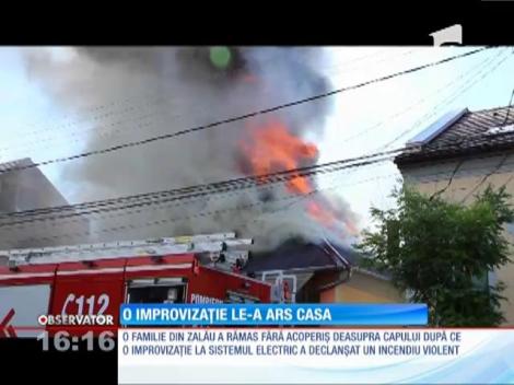 O familie din Zalău şi-a văzut acoperişul casei în flăcări