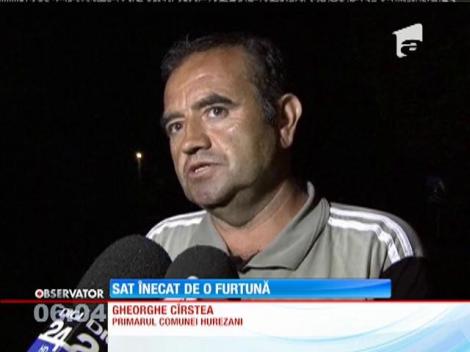 Sat inundat de o furtună