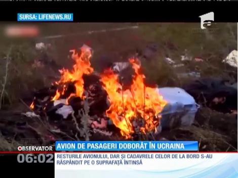 UPDATE! Noi imagini cu rămăşiţele avionului malaezian de pasageri, doborât în estul Ucrainei