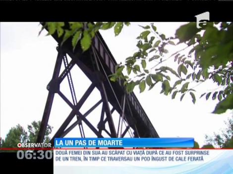 SUA: Două femei au fost surprinse de un tren pe un pod îngust de cale ferată
