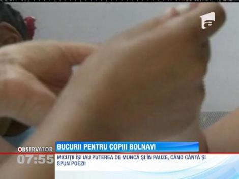 15 copii cu dizabilităţi mintale severe fac jucării pentru micuți bolnavi de cancer