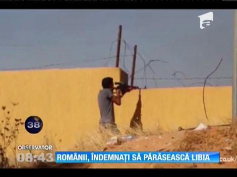 Românii, îndemnaţi să părăsească Libia