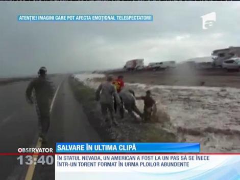 American salvat în ultima clipă din calea unui torent