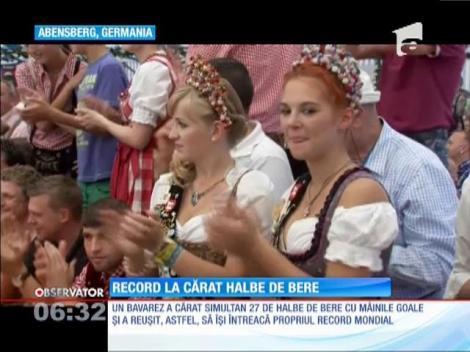 A cărat simultan 27 de halbe de bere cu mâinile goale