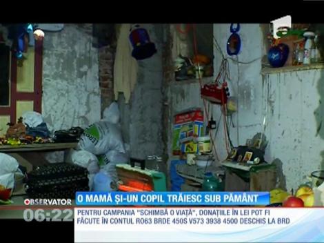 O mamă și un copil trăiesc sub păm&acirc;nt, l&acirc;ngă un cimitir!