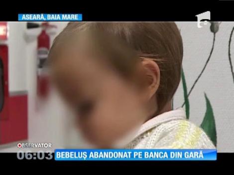 O fetiţă de zece luni, găsită pe o bancă, în gara din Baia Mare