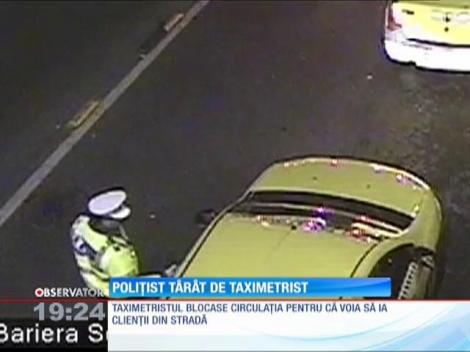 Poliţist târât cu maşina de un taximetrist