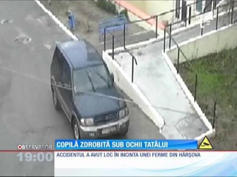 Copilă zdrobită sub ochii tatălui