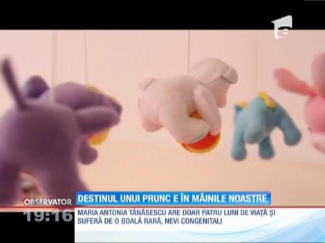 O aluniţă gigant acoperă trupul firav al unei fetiţe de patru luni