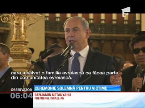 Victimele atentatului terorist din Franța, omagiate la Paris