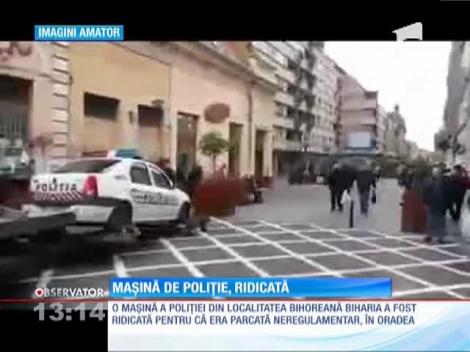 Maşină de poliţie ridicată de Serviciul Parcări