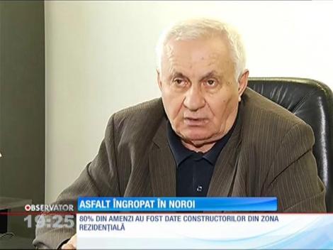 Asfalt îngropat în noroi