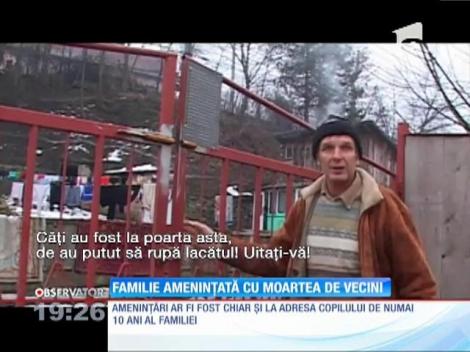 Familie amenințată cu moartea de vecini
