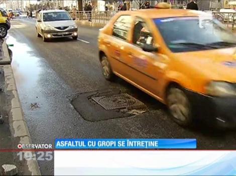Topirea zăpezilor scoate la suprafaţă sute de gropi în Capitală