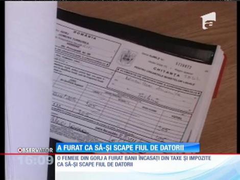 O mamă a furat ca să-şi scape fiul de datorii