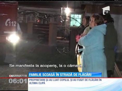 Familie scoasă în stradă de flăcări