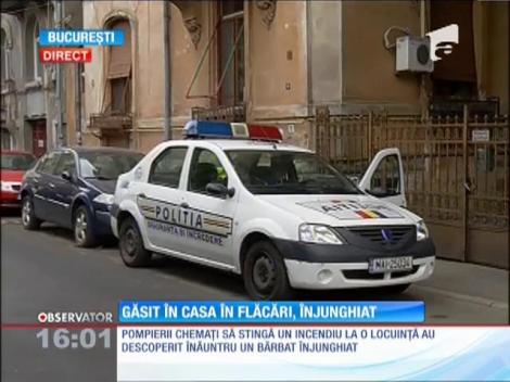 Bărbat găsit înjunghiat într-o casă în flăcări