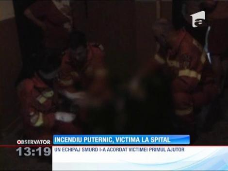 Incendiu puternic, victima la spital