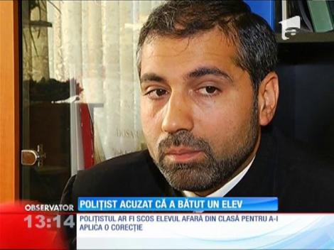 Poliţist acuzat că a bătut un elev