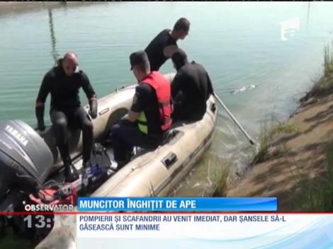 Muncitor înghiţit de ape