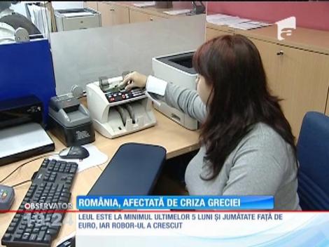 România, afectată dur de criza din Grecia. Leul este la minimul ultimelor 5 luni și jumătate faţă de euro
