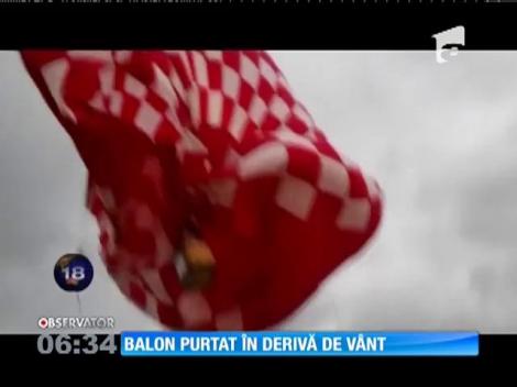Un balon umflat doar pe jumătate a fost luat de vânt şi purtat în derivă prin aer