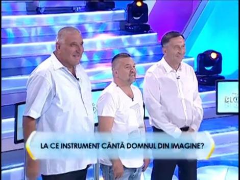 Runda 2: La ce instrument cântă domnul din imagine?
