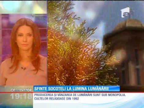 Preoţii folosesc un program de contabilitate care tine evidenţa resturilor de lumânări