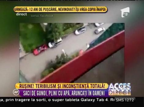 Înconștiență totală! Saci de gunoi plini cu apă, aruncați de la balcon în oameni